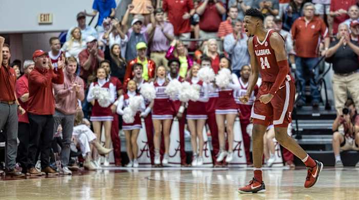 Alabama forward Brandon Miller (24) reacts to a stop against Auburn.